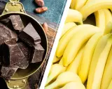 Dark chocolate chunks in a bowl and a pile of ripe bananas.